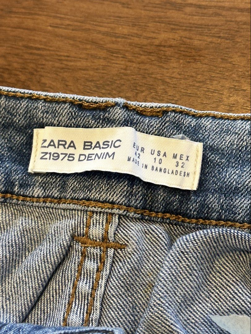 Zara Basic Denim Shorts with Pearl Embellishments (Category: Shorts) located in Makati City. Submitted by myclothesdefineme (Listing ID 1455194896, Image 3). Description: - Cute distressed denim shorts from Zara Basic - Features pearl embellishments on the front - Frayed hem detail for a trendy look - Size EUR 42 (USA 10, MEX 32) - Made in Bangladesh - Ideal for a stylish, casual vibe.