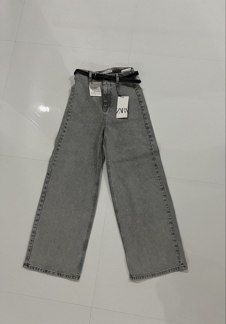 Zara Grey Wide Leg Belted Jeans (Category: Jeans) located in Cainta. Submitted by cendzz (Listing ID 1455277976, Image 1). Description: - Zara Grey Wide Leg Jeans - Size: 32 EUR - Style: High waisted - Condition: Brand new with tags, never worn - Includes: Black belt .