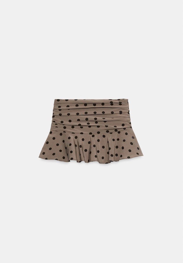 Zara skort (Category: Skirts) located in Davao. Submitted by audstuff (Listing ID 1455283774, Image 2). Description: - Cute brown mini skirt -BNWT AUTH ZARA - Black polka dot pattern - Ruched waistband for a comfortable fit - Ruffled hem for a feminine touch - Lightweight and flowy fabric - Versatile for casual wear, beach trips, or pairing with crop tops/t-shirts.