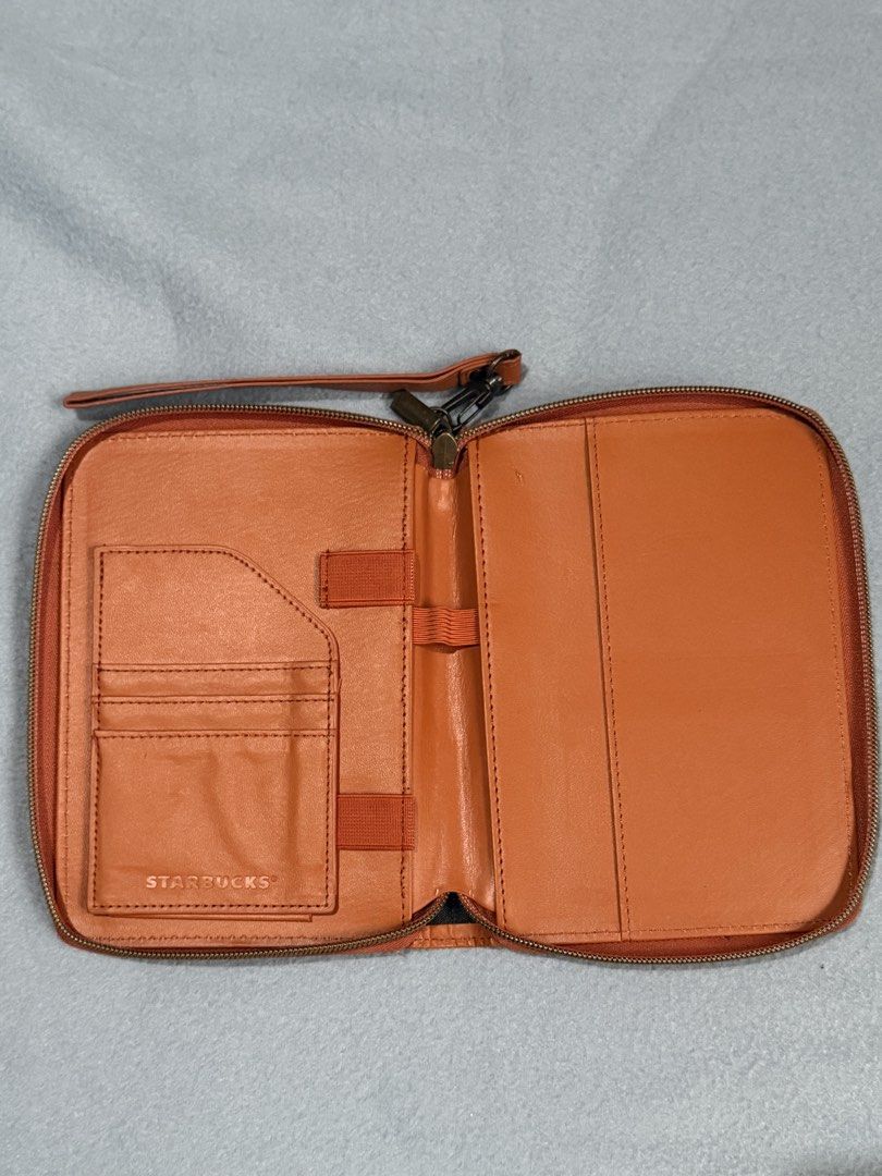 2 Starbucks Organizer Pouch Wallet Clutch (Category: Purses & Pouches) located in Santa Rosa. Submitted by _annepo (Listing ID 1455354726, Image 2). Description: Starbucks Planner organizers from previous years - Vibrant orange Starbucks organizer pouch - Convenient wrist strap for easy carrying - Secure zip closure to keep contents safe - Interior card slots for your essential cards - Elastic bands inside for securing items - Ideal for travel or
