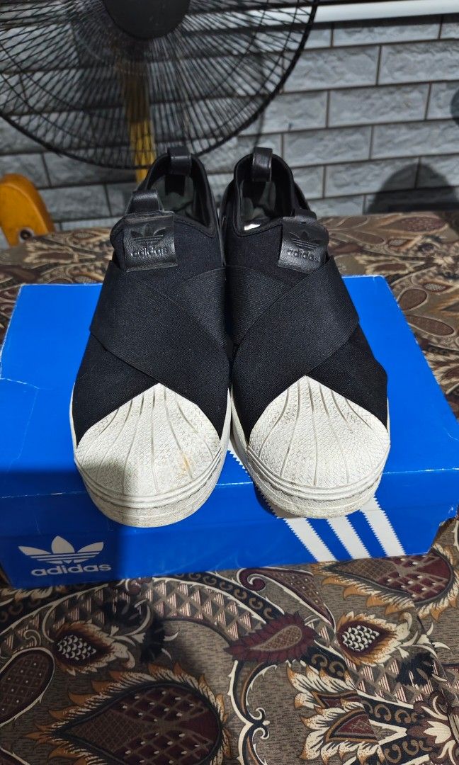 Adidas Superstar Slip On Shoes (Category: Sneakers) located in Manila. Submitted by ervinj23 (Listing ID 1455427007, Image 2). Description: - Adidas Superstar Slip-On Sneakers - Color: Black - Features classic shell toe design - Easy slip-on and off for convenience - Comes with original Adidas box - Ideal for casual and everyday wear.