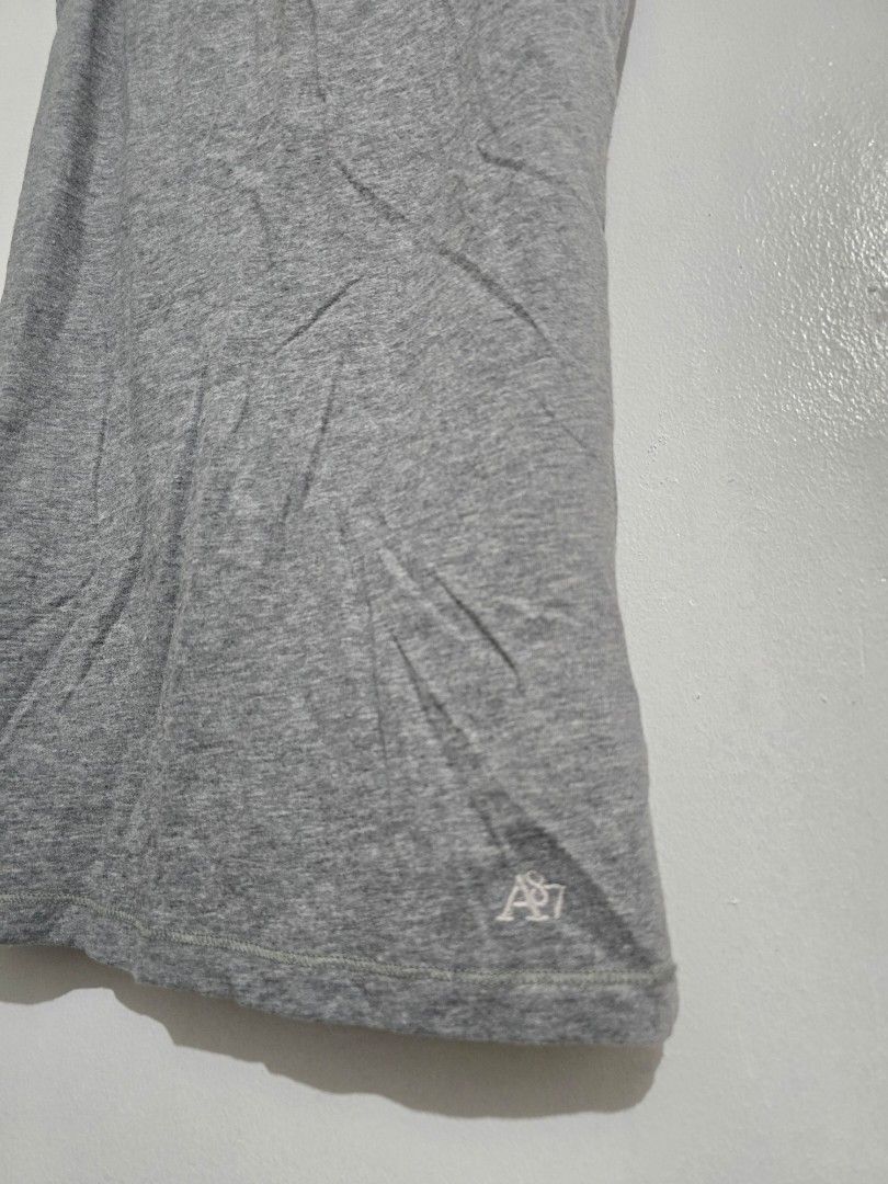 Aeropostale Grey Stretch Tank Top M/M (Category: Sleeveless) located in Quezon City. Submitted by eivan____orong (Listing ID 1455327192, Image 3). Description: - Grey tank top from Aeropostale - Made with comfortable stretch fabric - Features thin straps and a scoop neckline - Subtle Aeropostale logo on the side - Versatile for layering or wearing alone - Easy to pair with any outfit - (26L x 14W) xs - small fittings.