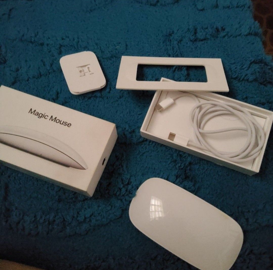 Apple Magic Mouse with Charging Cable and Box (With MAC receipt) (Category: Mouse & Mousepads) located in Manila. Submitted by aleahgam6336990 (Listing ID 1455369267, Image 1). Description: - Apple Magic Mouse (Rechargeable Model) - Includes original box - Includes original charging cable - Includes original plastic inserts - Ready for a new owner -Has a small yellow stain on the left part - Butuan City located, shipping via jnt.