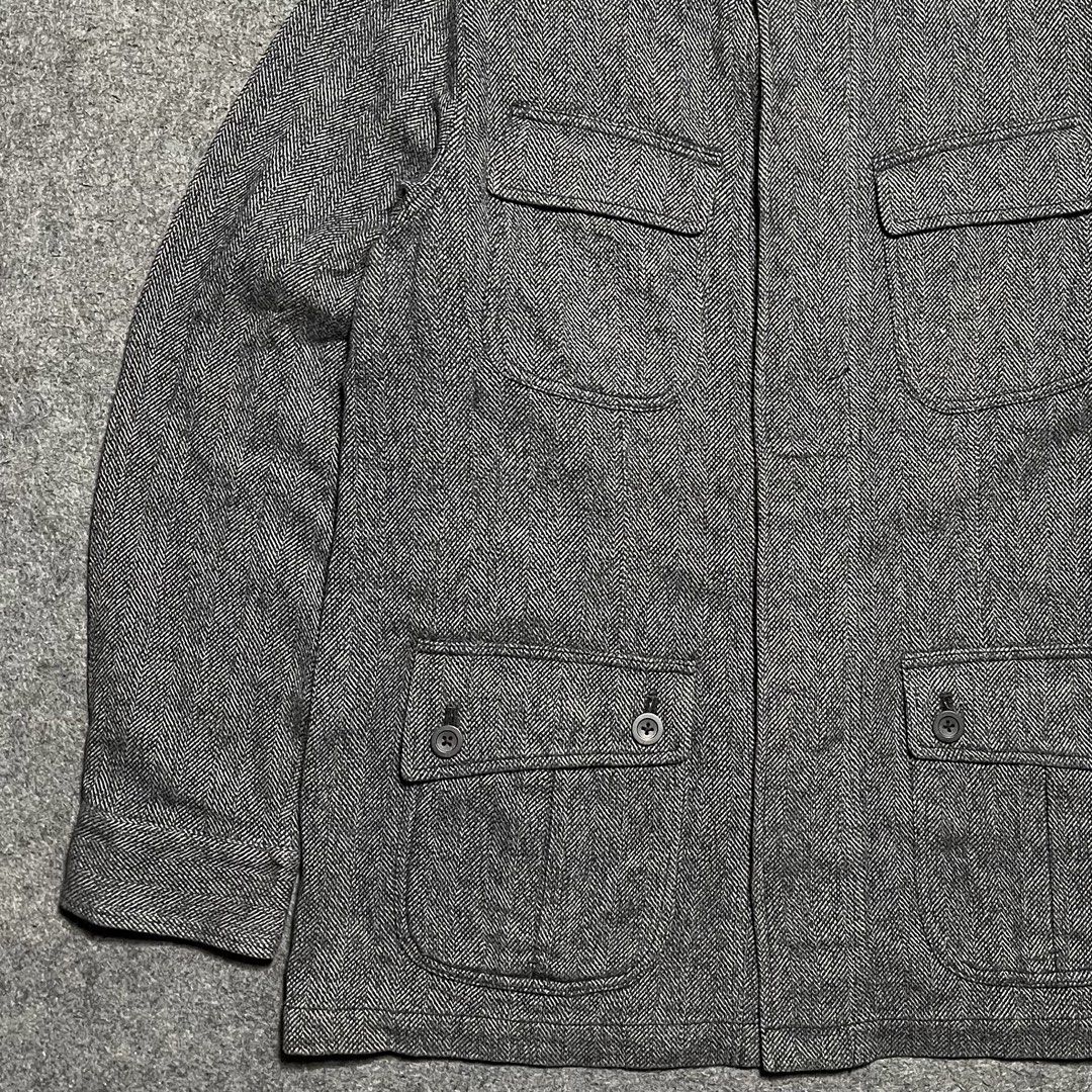 Aramis tweed Herringbone Safari Jacket (Category: Coats, Jackets and Outerwear) located in Zamboanga. Submitted by rag_20 (Listing ID 1455485453, Image 3). Description: Aramis tweed Herringbone Safari Jacket a classic pieces of vintage-inspired outerwear, combining utilitarian design with traditional tailoring textures,It uses a high-contrast grey and black herringbone weave, providing a textured, classic British or academic aesthetic, Heavy-text
