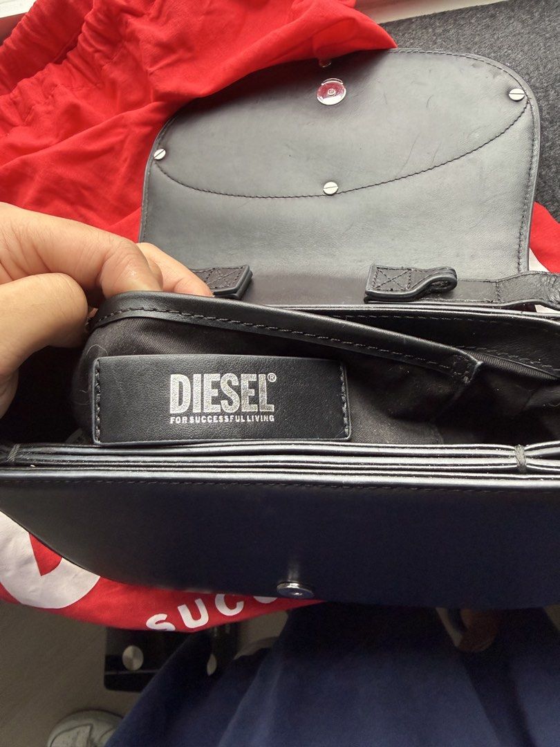 AUTHENTIC Diesel 1DR Black Leather Bag (Category: Shoulder Bags) located in Pasig City. Submitted by kfreed (Listing ID 1455350365, Image 3). Description: Authentic Diesel 1DR Black Leather Bag | With Original Dust Bag | Excellent Condition Authentic Diesel 1DR Black Leather Shoulder Bag Purchased in Hong Kong. Condition: • Excellent condition • Well maintained • Clean interior • Minimal signs of use Includes: Original Diesel dust bag .