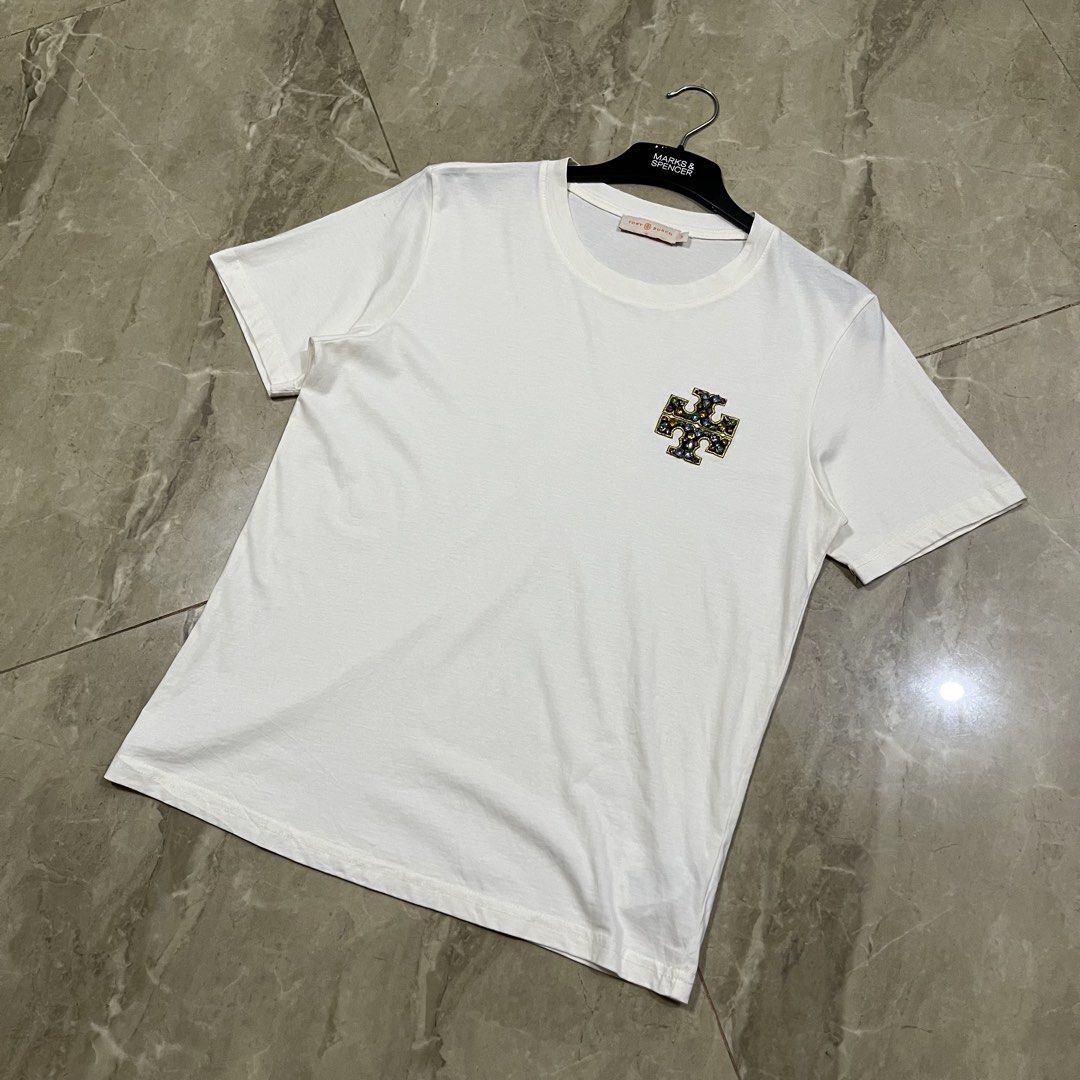 AUTHENTIC TORY BURCH EMBELLISHED LOGO SHIRT (Category: Luxury Apparel) located in Marikina City. Submitted by arniejane23 (Listing ID 1455373879, Image 3). Description: AUTHENTIC TORY BURCH EMBELLISHED LOGO SHIRT SIZE SMALL ON TAG DIMENSION width - 18.5 length - 24 NO ISSUE/NO FLAWS EXCELLENT LIKE NEW CONDITION!! 📩📩📩.