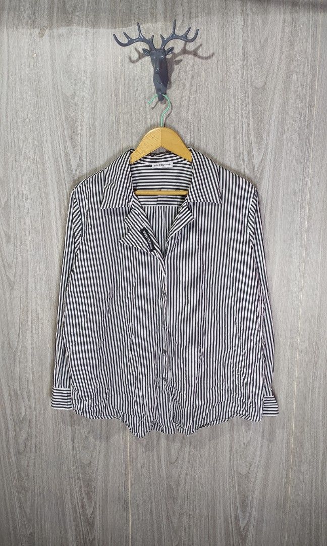 Balenciaga Striped Button Down Long Sleeve (Category: Longsleeves) located in Naga. Submitted by secondspinv2 (Listing ID 1455361994, Image 1). Description: Balenciaga Striped Button Down Long Sleeve ✅Size: M ✅Width: 23.5 ✅Length: 27 ✅Sleeve: 23 ✅Color Rate: 9.5/10 ✅No Issue ✅Need Wash ✅Location: Bicol Naga City, Camarines Sur ✅Courier: J&T Express/Flash Express ✅MOP: Gcash only.