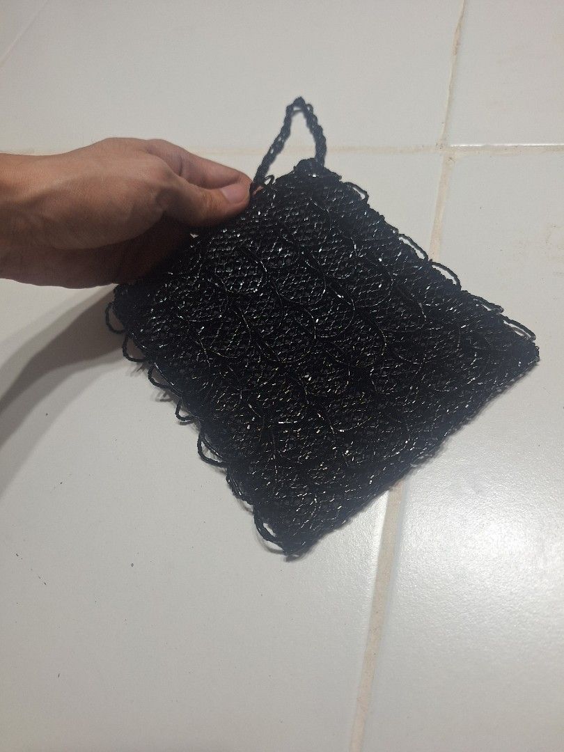 Black Beaded Clutch Bag with beaded Strap (Category: Clutches) located in Las Pinas. Submitted by second.founds (Listing ID 1455396735, Image 2). Description: Beaded scales bag - 5.5 inches by 6 inches Strap - 51 inches -What you see is what you get. -Lightly used -Mop: gcash / bdo -courier: ggx - Cute black beaded clutch bag - Delicate chain strap included - Perfect for nights out or special occasions - Intricate beading pattern - Secure snap bu