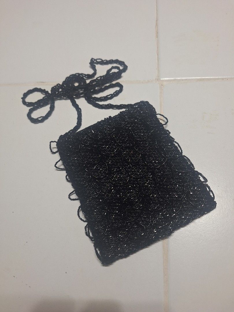 Black Beaded Clutch Bag with beaded Strap (Category: Clutches) located in Las Pinas. Submitted by second.founds (Listing ID 1455396735, Image 1). Description: Beaded scales bag - 5.5 inches by 6 inches Strap - 51 inches -What you see is what you get. -Lightly used -Mop: gcash / bdo -courier: ggx - Cute black beaded clutch bag - Delicate chain strap included - Perfect for nights out or special occasions - Intricate beading pattern - Secure snap bu
