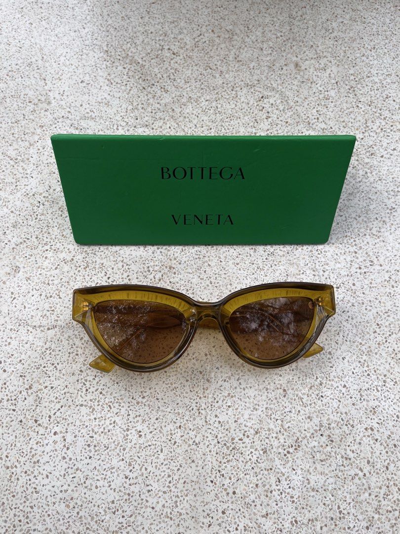 Bottega Veneta Sunglasses (Category: Sunglasses & Eyewear) located in Makati City. Submitted by offthemetro (Listing ID 1455332755, Image 1). Description: - Authentic Bottega Veneta sunglasses - Stylish translucent amber frame - Brown tinted lenses for sun protection - Comes with original Bottega Veneta box - Ideal for sunny weather 💡Barely Used.