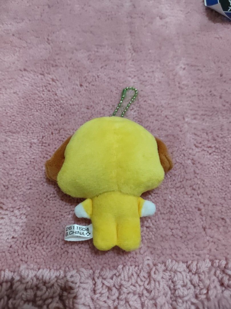 BT21 Chimmy Plush Keychain Yellow (Category: Plushies & Soft Toys) located in Bulacan. Submitted by hunterherojapanjdm (Listing ID 1455410777, Image 2). Description: - Adorable BT21 Chimmy plush keychain - Bright yellow character with cute brown ears and feet - Features a stylish green beaded chain - Includes a white BT21 tag, no ppt - Small and portable, ideal for decorating bags or backpacks.