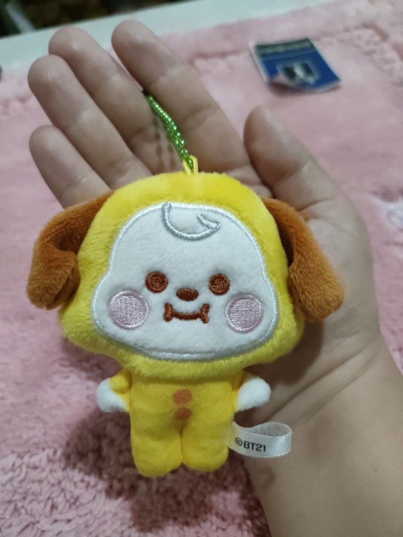 BT21 Chimmy Plush Keychain Yellow (Category: Plushies & Soft Toys) located in Bulacan. Submitted by hunterherojapanjdm (Listing ID 1455410777, Image 3). Description: - Adorable BT21 Chimmy plush keychain - Bright yellow character with cute brown ears and feet - Features a stylish green beaded chain - Includes a white BT21 tag, no ppt - Small and portable, ideal for decorating bags or backpacks.