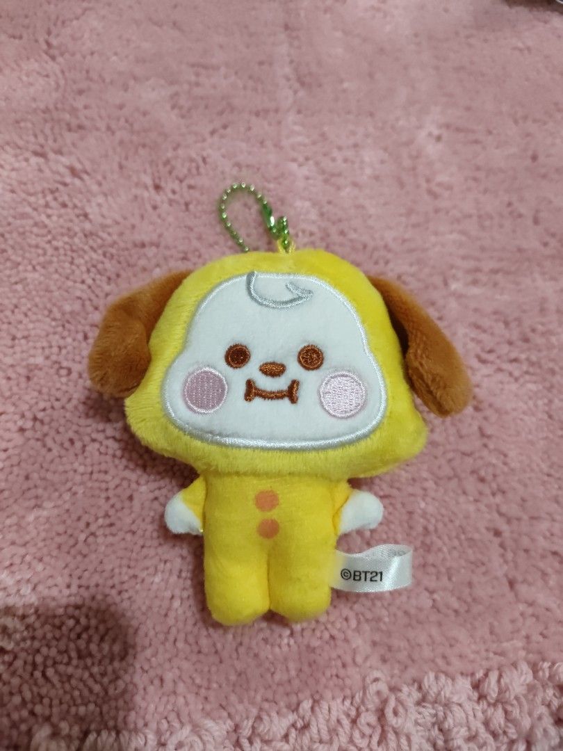 BT21 Chimmy Plush Keychain Yellow (Category: Plushies & Soft Toys) located in Bulacan. Submitted by hunterherojapanjdm (Listing ID 1455410777, Image 1). Description: - Adorable BT21 Chimmy plush keychain - Bright yellow character with cute brown ears and feet - Features a stylish green beaded chain - Includes a white BT21 tag, no ppt - Small and portable, ideal for decorating bags or backpacks.
