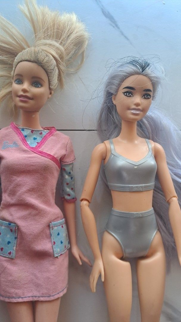 Bundle of 4 Barbie Dolls (Category: Kids Toys) located in Davao. Submitted by bravemoon_556cd5 (Listing ID 1455386345, Image 2). Description: - Bundle of 4 Barbie dolls - Includes: Princess doll, Rapunzel-inspired doll, Doctor/Nurse doll, Modern doll with grey hair - All dolls from a smoke-free home - Great for collectors or playtime.