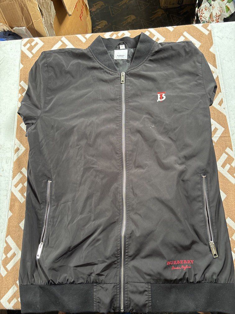 Burberry Jacket (Category: Coats, Jackets and Outerwear) located in Baguio. Submitted by brix6699 (Listing ID 1455344439, Image 1). Description: Burberry jacket Xxl on tag Dimensions: Width23.5 inches Length30 inches Length of sleeves 26 inches No issues .