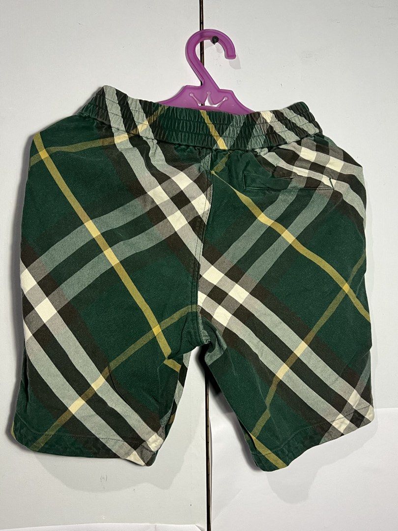 Burberry Plaid Shorts (Category: Babies & Kids Fashion) located in Quezon City. Submitted by ishaan1423 (Listing ID 1455390386, Image 2). Description: - Classic Burberry plaid shorts - Green base with yellow, white, and brown checks - Comfortable elastic waistband - Made in Thailand - 100% cotton fabric - Ideal for everyday wear or playtime.