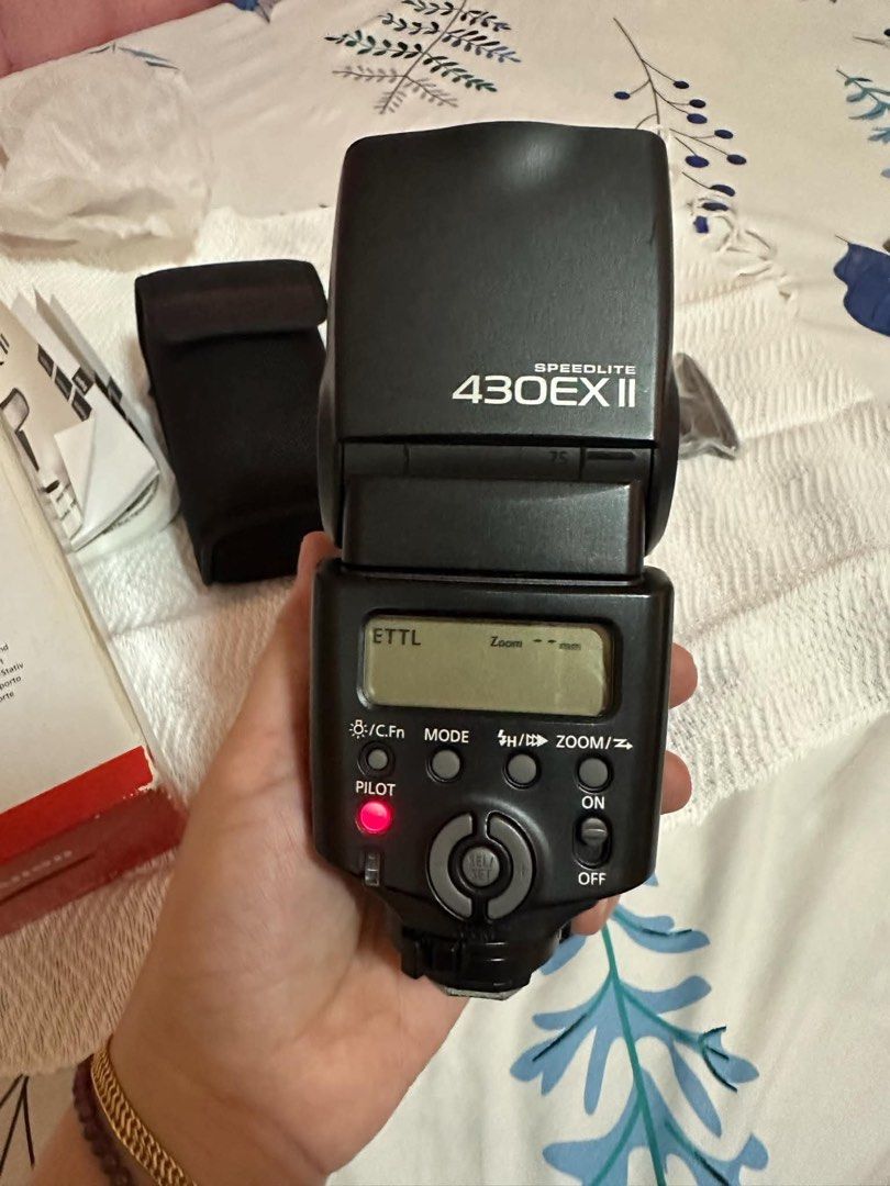 Canon Speedlite 430EX II External Flash (Category: Flashes) located in Manila. Submitted by TindahanNiLhelay (Listing ID 1455338134, Image 3). Description: - Canon Speedlite 430EX II external flash - Includes flash unit, soft case, and original box - Also comes with stand and diffuser - Tested and working.