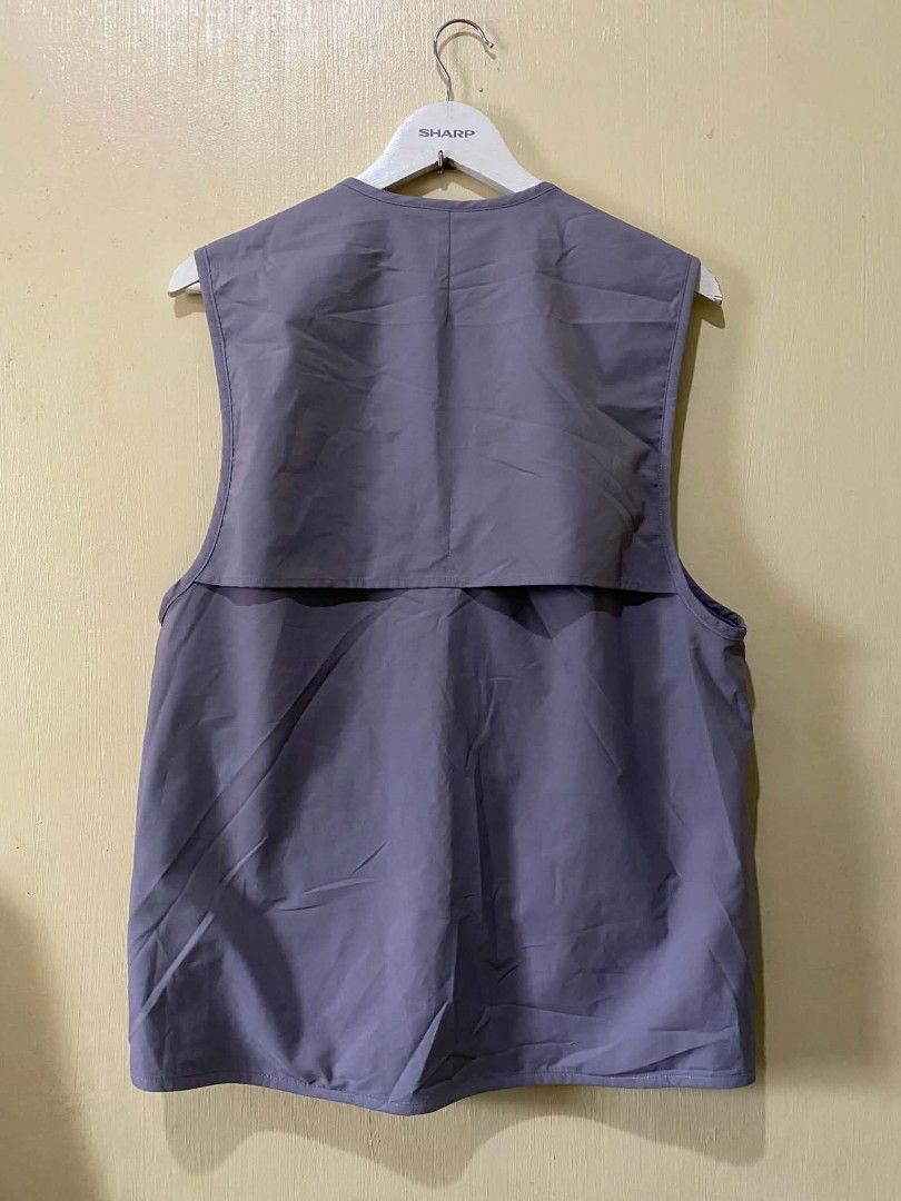 CATALOG Acid-House Geologic Temp Record Vest (Category: Vests) located in Manila. Submitted by cozci (Listing ID 1455372329, Image 2). Description: - CATALOG Grey Utility Vest - Unique Acid-House Geologic Temp Record design - Multiple pockets with buckle and strap closures - Mesh lining inside - Size: M / 175 / 92A - Material: Polyethylene.