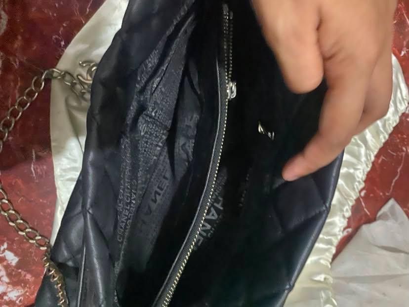 Chanel Quilted Leather Chain Shoulder/Tote Bag (Category: Luxury Bags & Wallets) located in Lucena. Submitted by minos_world (Listing ID 1455455812, Image 3). Description: Medium to large size - Black quilted leather - Silver-tone chain strap - Interior zippered pocket Issues: May bakat ng ipit and rust on the silver straps rfs nakita ko lang po yan sa ilalim ng kama.