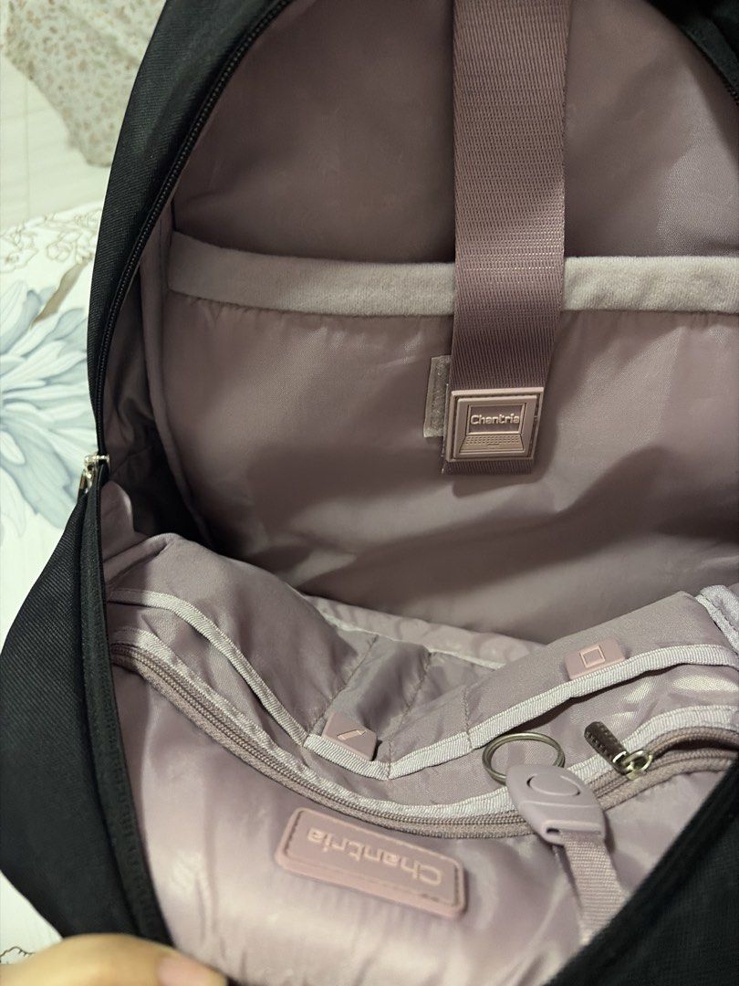 9.9 Sale Chantria Black Backpack with Charms (Category: Backpacks) located in Morong. Submitted by Kaycer00 (Listing ID 1455494447, Image 3). Description: - Brand: Chantria - Color: Black - Features: Front zip pocket with cute leaf and flower charms - Interior: Multiple compartments and pockets for organization - Straps: Adjustable and padded for comfort - Ideal for: School or everyday use With free beach bag brand new.