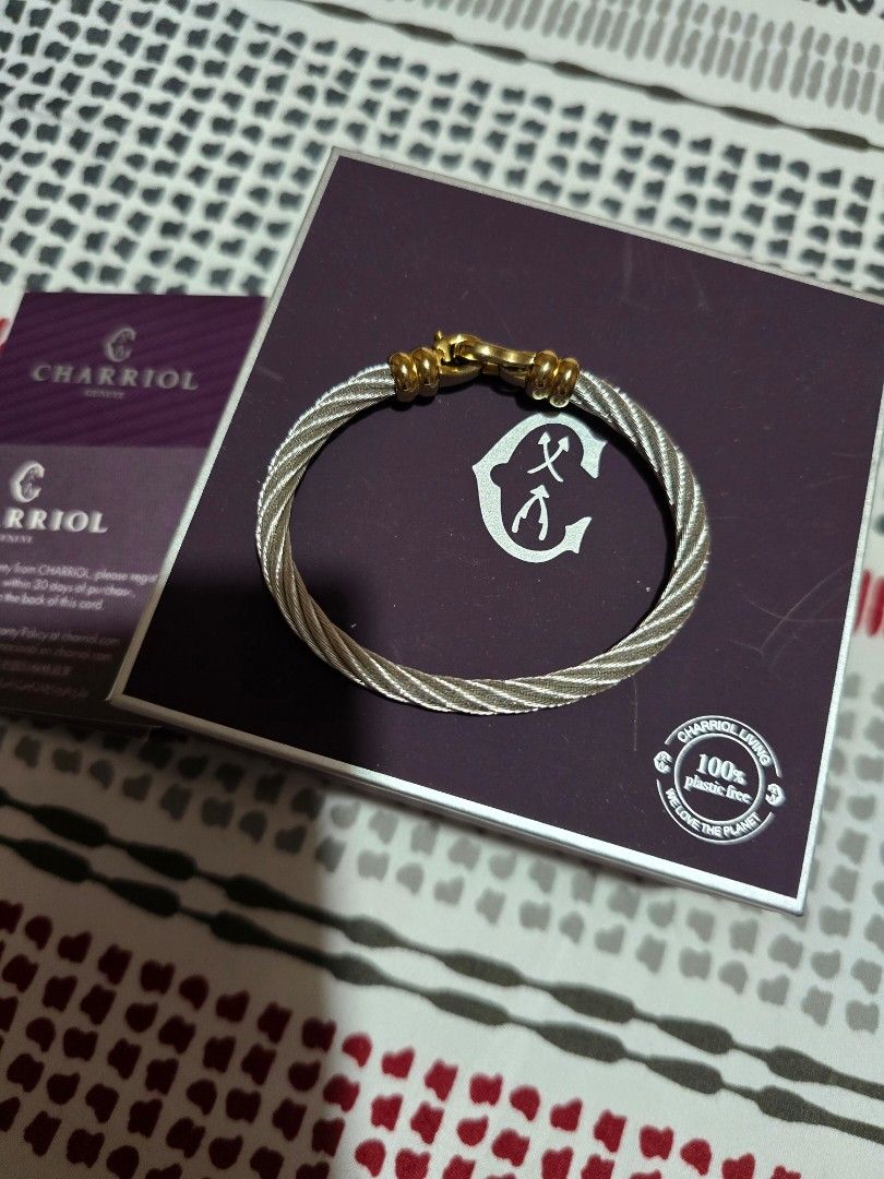 Charriol Geneva Cable Bracelet with Gold Clasp (Category: Bracelets) located in Las Pinas. Submitted by luxeprelovedstuff (Listing ID 1455387063, Image 3). Description: - Authentic Charriol Ibiza cable bracelet - Signature twisted cable design - Polished gold clasp - Includes original box - Includes international warranty card - Purchased on August 7, 2022 - Perfect addition to your jewelry collection store bought, with complete inclusion .