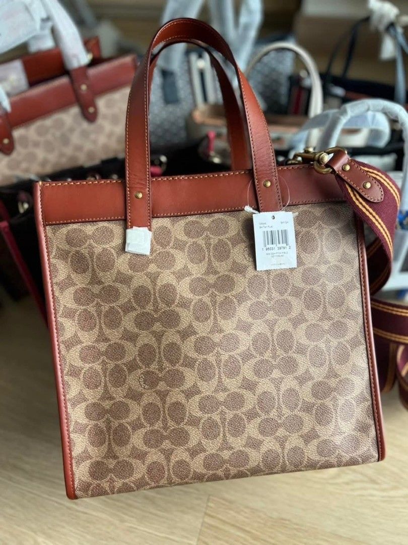 Coach Field Tote with Patches (Category: Tote Bags) located in Quezon City. Submitted by bagsboutiqueph (Listing ID 1455443887, Image 2). Description: LAST PRICE POSTED. LIMITED STOCKS! BRANDNEW WITH INCLUSIONS. COLOR MAY SLIGHTLY VARY IN ACTUAL DUE TO LIGHTING AND CAMERA SETTING. OTHER PHOTOS WILL BE SEND DURING PURCHASE AND FOR SURE BUYERS ONLY. WHEN IN DOUBT, DO NOT ORDER. THANK YOU..