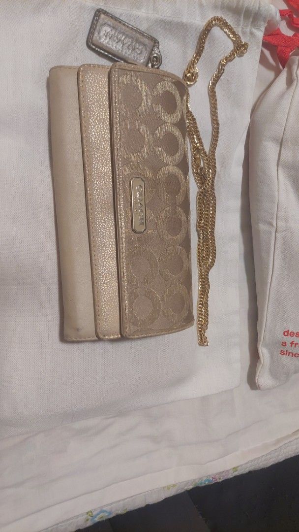 Coach Signature C Monogram Wallet with Chain (Category: Luxury Bags & Wallets) located in Paranaque City. Submitted by daddyu (Listing ID 1455470374, Image 2). Description: - Authentic Coach wallet with signature C pattern - Detachable gold chain strap included - Comes with original Coach hangtag - Used but still good condition with sign of Usage..