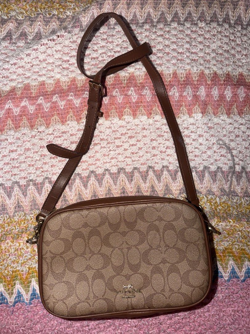 Coach Signature Monogram Crossbody Bag (Category: Luxury Bags & Wallets) located in Quezon City. Submitted by miccosredtruck (Listing ID 1455461534, Image 1). Description: - Authentic brown Coach crossbody bag - Signature monogram pattern with leather trim - Gold-tone hardware - Secure zipper closure - Interior Coach authenticity tag - Ideal for everyday wear.