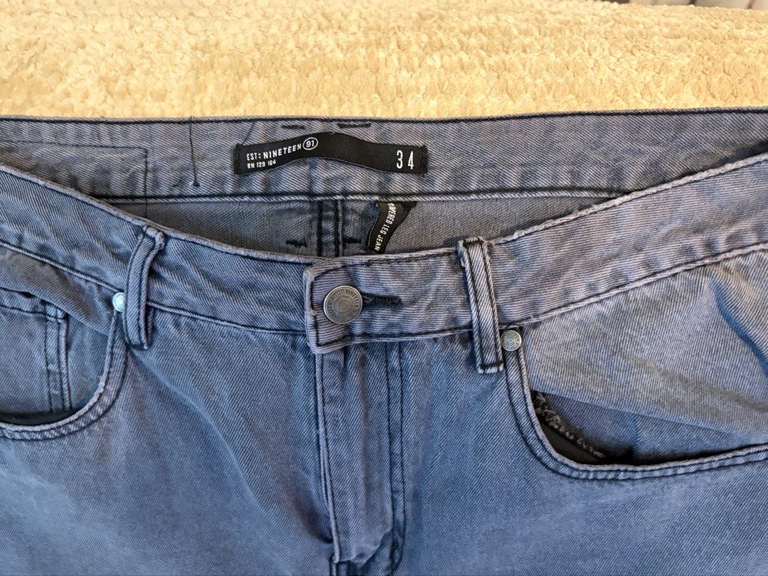 Cotton On Distressed Denim Jeans Size 34 (Category: Jeans) located in Taguig. Submitted by domie (Listing ID 1455378225, Image 2). Description: Grey denim jeans, EST:NINETEEN, Size 34. Features a distressed rip on the left knee and a straight leg fit. Button/zip closure, two back pockets. Perfect for casual outings..