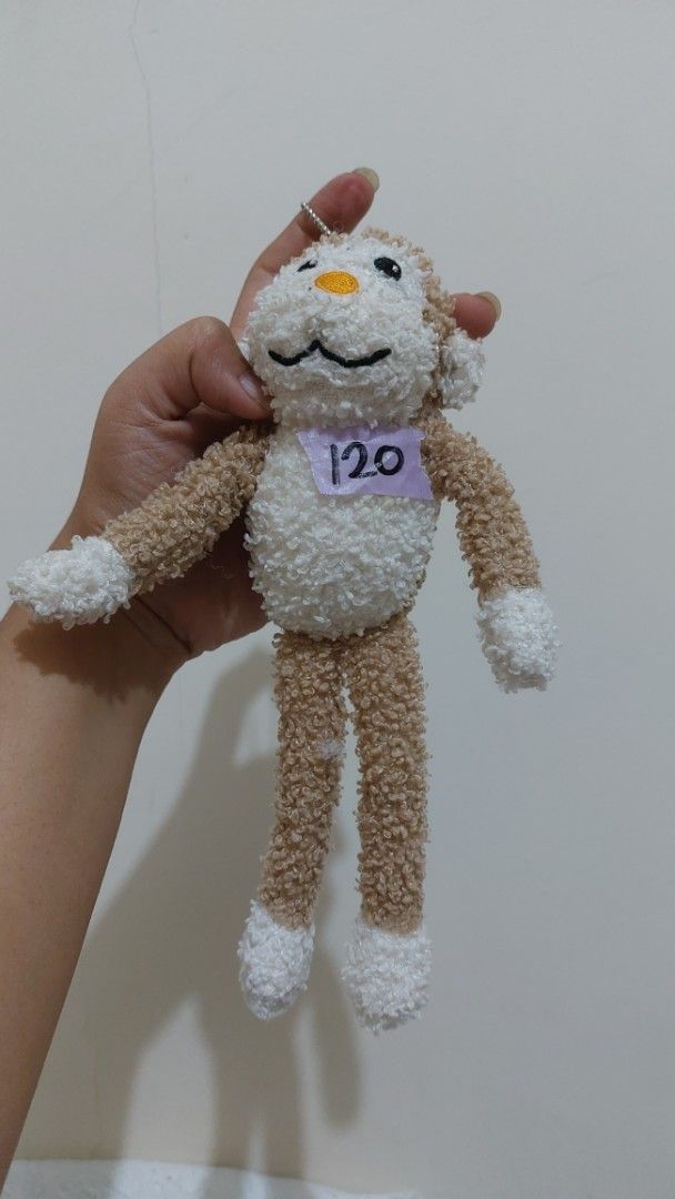Cute Fluffy Monkey Plush Toy Keychain (Category: Plushies & Soft Toys) located in Mandaluyong City. Submitted by 13thsilverrabbit (Listing ID 1455490672, Image 1). Description: - Adorable fluffy bunny plush toy - Comes with a keychain attachment - Has a small tag with the number '20' - Ideal for decorating bags or as a small gift - Very soft and cuddly texture.