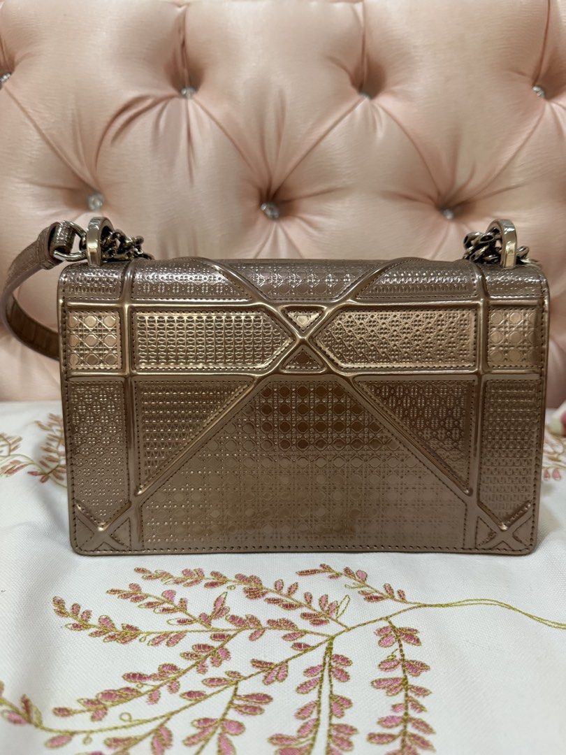 Authentic Diorama Medium Metallic Micro Cannage Flap Bag (Category: Luxury Bags & Wallets) located in Quezon City. Submitted by glassslipperprincess (Listing ID 1455440876, Image 2). Description: Raised stitching in the brand’s iconic Cannage pattern and a unique crest-shaped closure define this patent leather bag that can be carried as a clutch or worn across the body with an optional chain-link strap. - Color: Rose Gold Metallic - Black interio