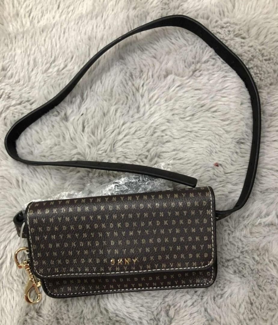 DKNY Brown monogram crossbody / belt bag (Category: Shoulder Bags) located in San Fernando. Submitted by happyteynguin (Listing ID 1455323078, Image 1). Description: Brand: DKNY Style: Brown monogram crossbody / belt bag Color: Dark brown / black monogram Hardware: Gold-tone Strap: Long adjustable strap.