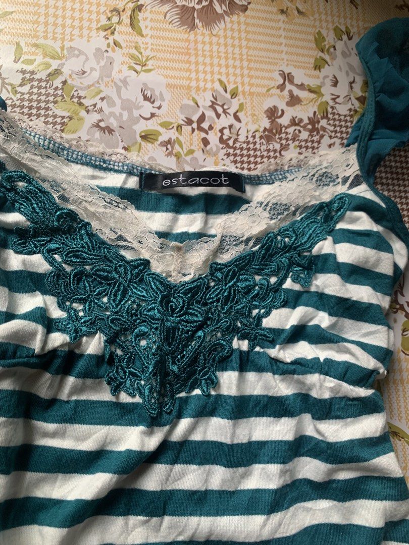 Estacot Striped Tank Top with Lace (Category: Sleeveless) located in Cebu City. Submitted by selamethrift (Listing ID 1455396780, Image 2). Description: - Green and white striped tank top - Features lace trim along the neckline and hem - Pretty embroidered detail on the chest - Ruffled straps for a feminine touch .