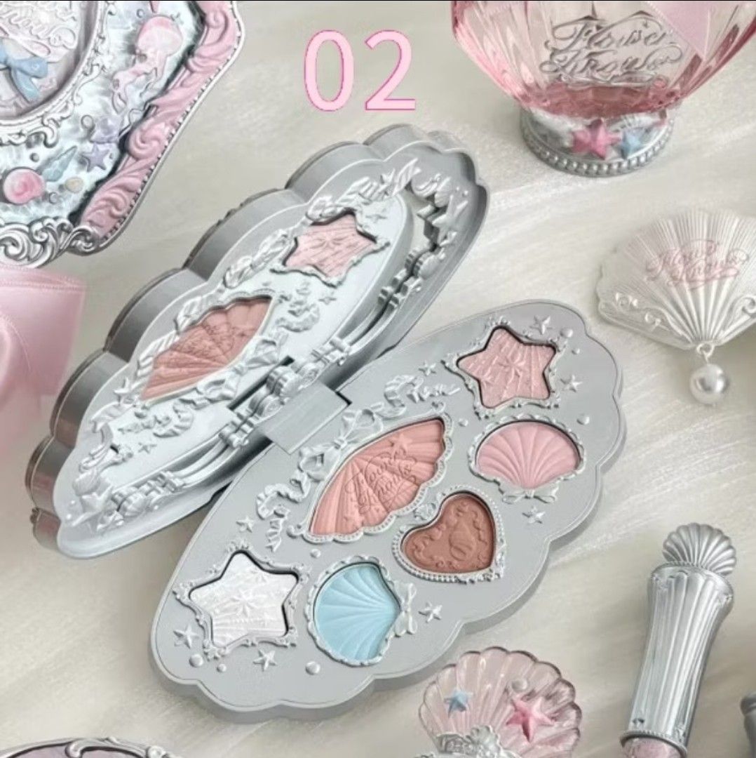 Flower Knows #02 Shell 6 color Eyeshadow Palette (Category: Makeup) located in Dasmarinas. Submitted by awieee_lyss28 (Listing ID 1455412622, Image 3). Description: - Flower Knows eyeshadow palette in shade #02, 'Shell'. - Features a cute, unique shell-shaped compact. - Includes beautiful pink, blue, and shimmery shades. - Ideal for creating soft, natural, and shimmery eye looks. - Comes in a pretty and collectible compact. NEGOTIABLE .