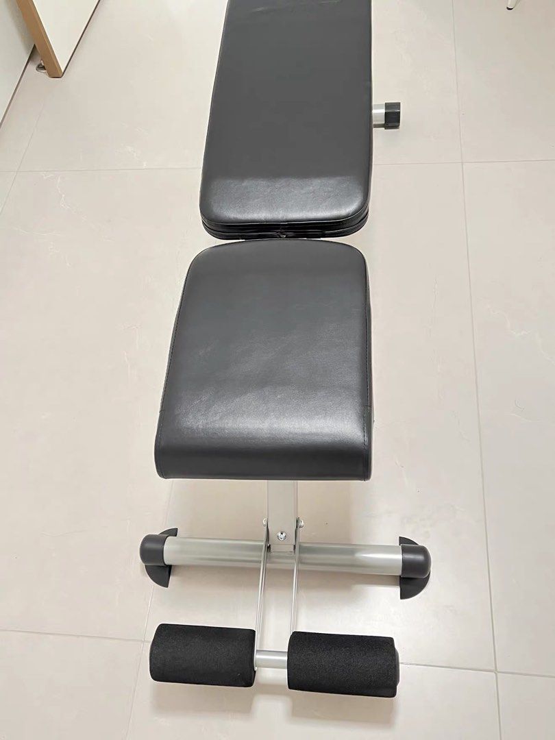 foldable exercise bench (Category: Weights & Dumbbells) located in Singapore. Submitted by jioz2809 (Listing ID 1455445845, Image 2). Description: - Adjustable backrest and seat angles - Integrated leg rollers for extra exercises - Solid construction, ideal for home training - Ready for your next workout session self pick up from Dakota.