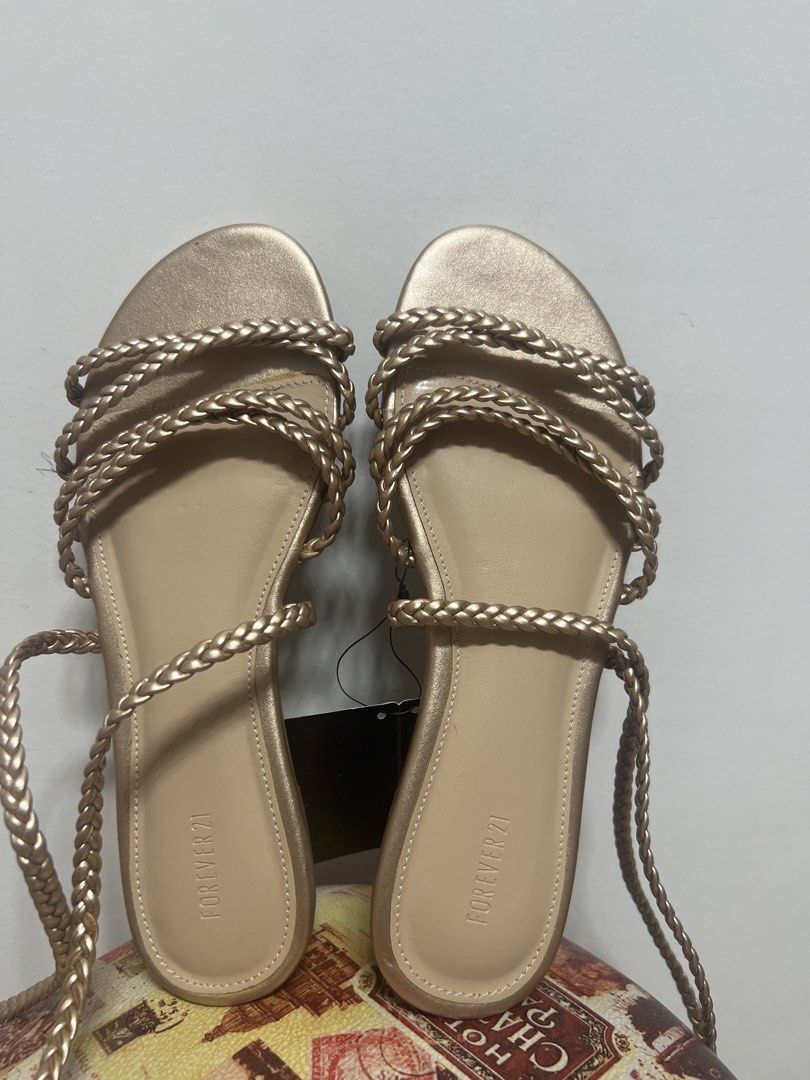 Forever 21 Gold Braided Lace-Up Flat Sandals (Category: Flats & Sandals) located in Makati City. Submitted by lilfinds (Listing ID 1455422741, Image 3). Description: Forever 21 Rose Gold Braided Strappy Sandals – Size 6.5 ₱500– Negotiable Brand new / never worn Forever 21 braided strappy flat sandals in a beautiful rose gold metallic color. ✨ * Forever 21 * Size: US 6.5 / EU 37.5 / 23.5 cm * Rose gold metallic * Braided multi-strap design * Ankle