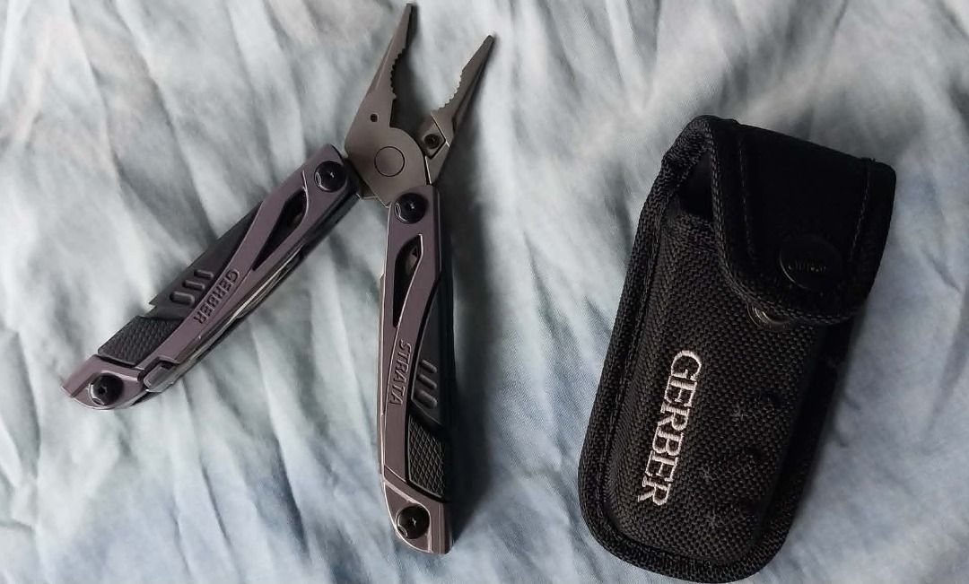 Gerber Strata Multi-tool with Pouch (Category: Hiking & Camping) located in Quezon City. Submitted by peterlu99979137 (Listing ID 1455388250, Image 1). Description: - Gerber Strata multi-tool - Includes black Gerber pouch - Compact and handy for everyday carry (EDC) - Ideal for quick fixes and various tasks - Integrated tools: pliers, knife, and more - Pouch features a convenient belt loop.