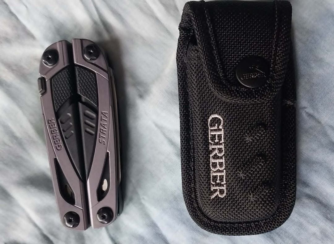 Gerber Strata Multi-tool with Pouch (Category: Hiking & Camping) located in Quezon City. Submitted by peterlu99979137 (Listing ID 1455388250, Image 2). Description: - Gerber Strata multi-tool - Includes black Gerber pouch - Compact and handy for everyday carry (EDC) - Ideal for quick fixes and various tasks - Integrated tools: pliers, knife, and more - Pouch features a convenient belt loop.