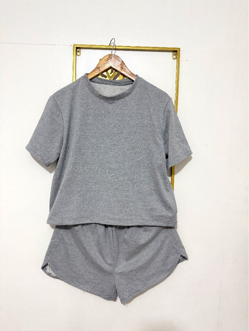 Grey Sweatshirt and Shorts Set (Category: Sets or Coordinates) located in Manila. Submitted by ohhlalala (Listing ID 1455489275, Image 1). Description: - Comfy grey loungewear set - Includes short-sleeved crewneck top - Matching elastic waist shorts - Made from soft fabric - Perfect for relaxing at home or casual outings - Easy to wear.