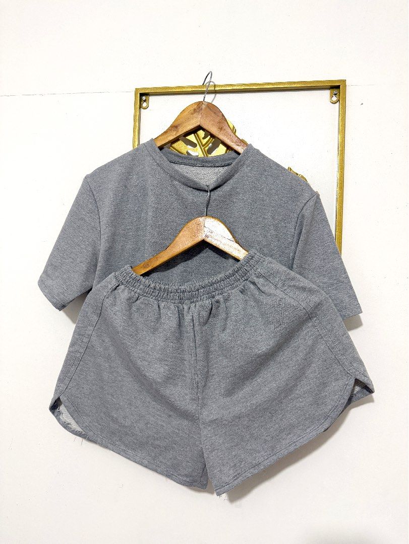 Grey Sweatshirt and Shorts Set (Category: Sets or Coordinates) located in Manila. Submitted by ohhlalala (Listing ID 1455489275, Image 2). Description: - Comfy grey loungewear set - Includes short-sleeved crewneck top - Matching elastic waist shorts - Made from soft fabric - Perfect for relaxing at home or casual outings - Easy to wear.