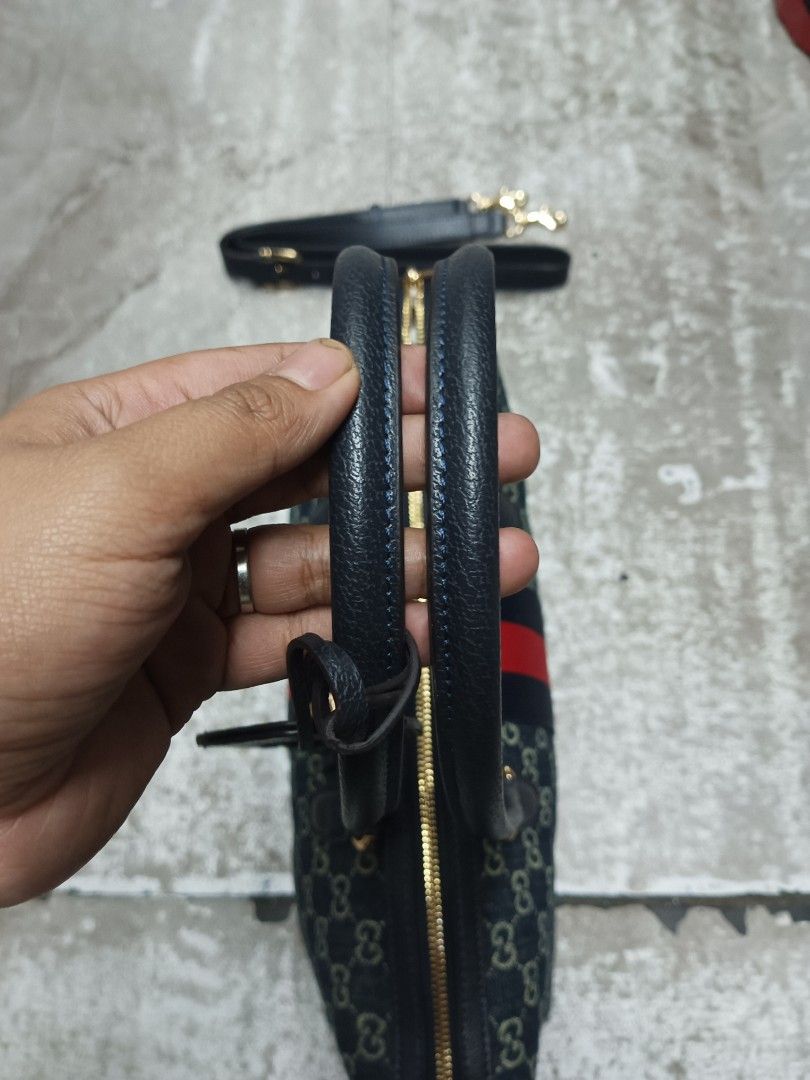 Gucci Monogram Denim Vintage Boston Bag (Category: Luxury Bags & Wallets) located in Baguio. Submitted by brandeditems16 (Listing ID 1455495996, Image 2). Description: - Classic Gucci Boston bag - Iconic GG monogram on denim canvas - Signature red and blue stripe detail - Detachable shoulder strap included - Gold hardware - Zipper closure - Spacious interior - Comes with a leather tag.