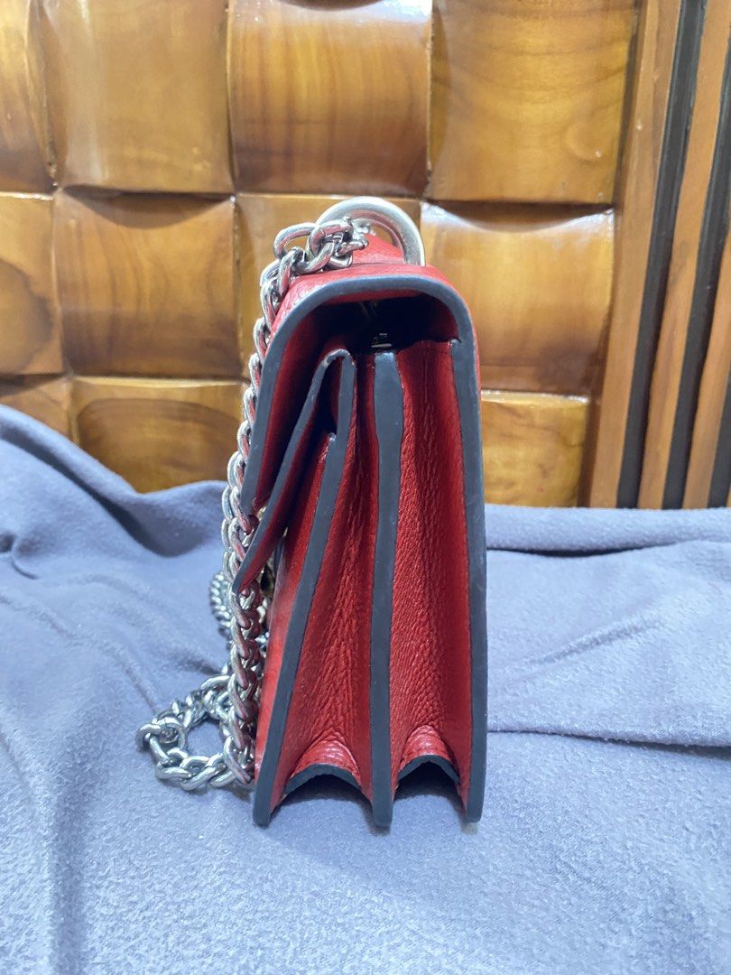 Gucci Red Leather Dionysus Chain Bag (Category: Luxury Bags & Wallets) located in Zamboanga. Submitted by smartstyle (Listing ID 1455334936, Image 2). Description: - Authentic Red Gucci Dionysus Bag - Material: Pebbled Leather - Signature Tiger Head Closure with Red Crystal Details - Silver-Tone Chain Strap - Multiple Interior Compartments - Interior Zip Pocket - Visible Serial Number - Perfect Statement Piece.