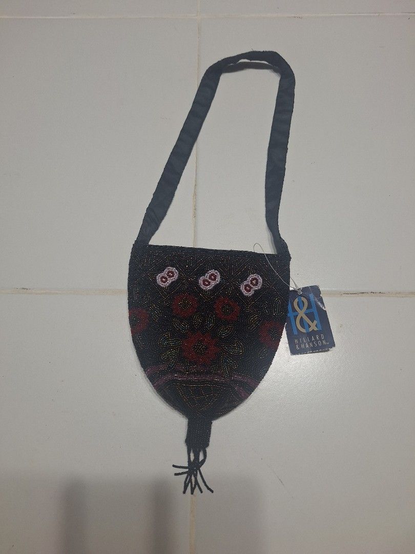 Hillard & Hanson Beaded Bag with Floral Design (Category: Shoulder Bags) located in Las Pinas. Submitted by second.founds (Listing ID 1455396437, Image 1). Description: Hillard and Hanson beaded bag -7 inches by 7 inches Strap - 25.5 inches -What you see is what you get. -Brabd new with tags -Mop: gcash / bdo -courier: ggx - Elegant black beaded bag - Features vibrant red and white floral patterns - Adorned with a stylish tassel detail at the bot