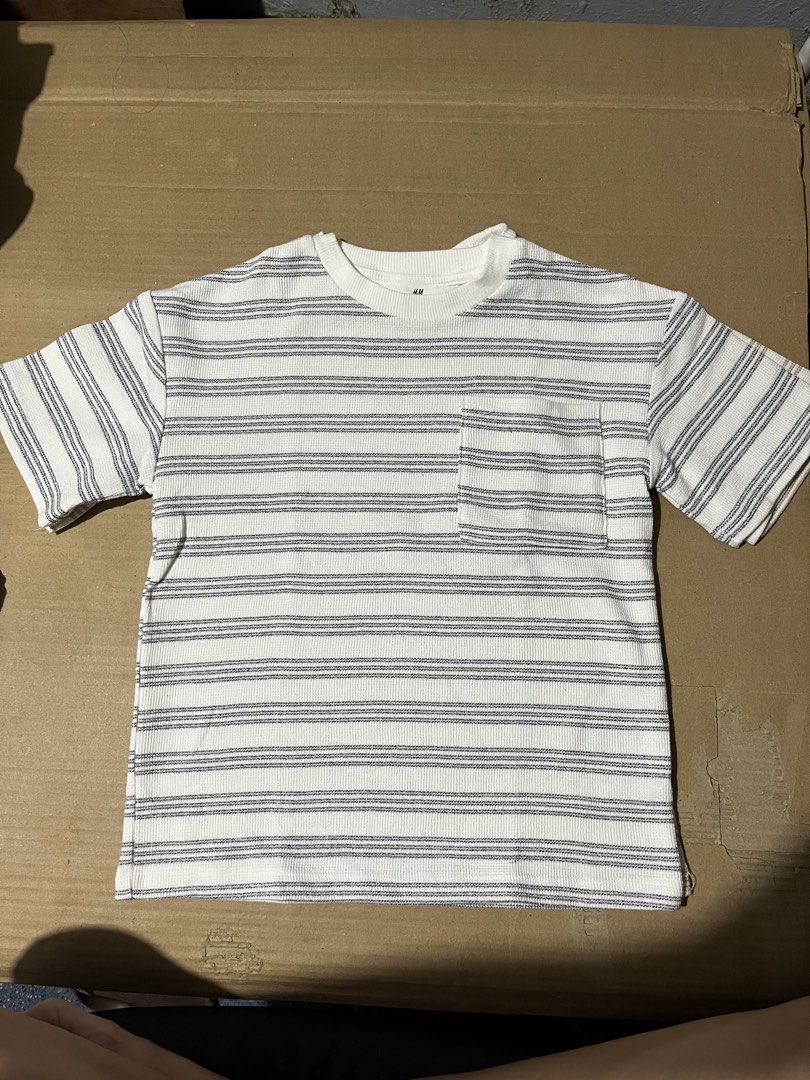 H&M 4 T-shirts BUNDLE! WITH FREEBIE Sando (Category: Babies & Kids Fashion) located in Manila. Submitted by hi_abbd (Listing ID 1455477168, Image 3). Description: - Bundle of 4 H&M t-shirts for boys - Includes 2 striped t-shirts (white with blue stripes and pocket, off-white with brown stripes) - Also includes 2 graphic t-shirts (one with dinosaurs and sequins, one with a skeleton graphic) - All are short-sleeved with crew necks - Perfect for cas