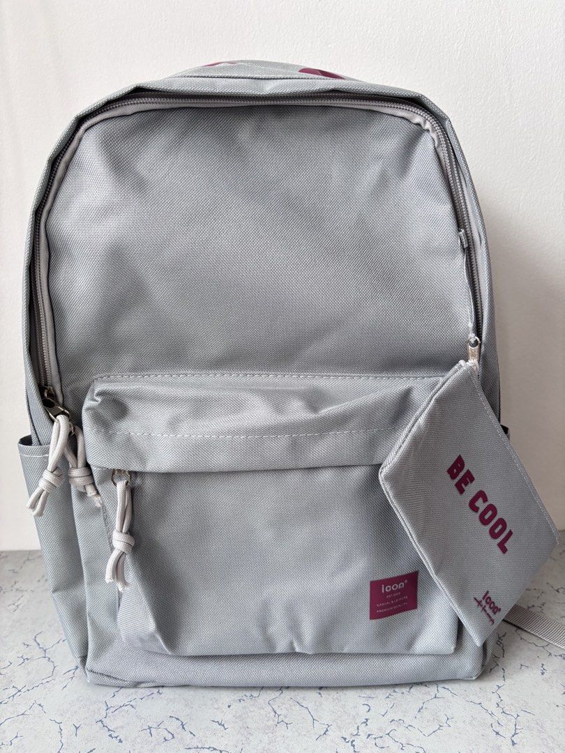 ICON Polyester Backpack (Category: Stationery & School Supplies) located in Singapore. Submitted by snowyforest (Listing ID 1455393340, Image 2). Description: * Grey with Red silkscreen ‘ BE COOL’ printing * Zip closure with rope zip puller * Front large wide pocket * Two side pockets for umbrella and water bottle * Adjustable shoulder strap.