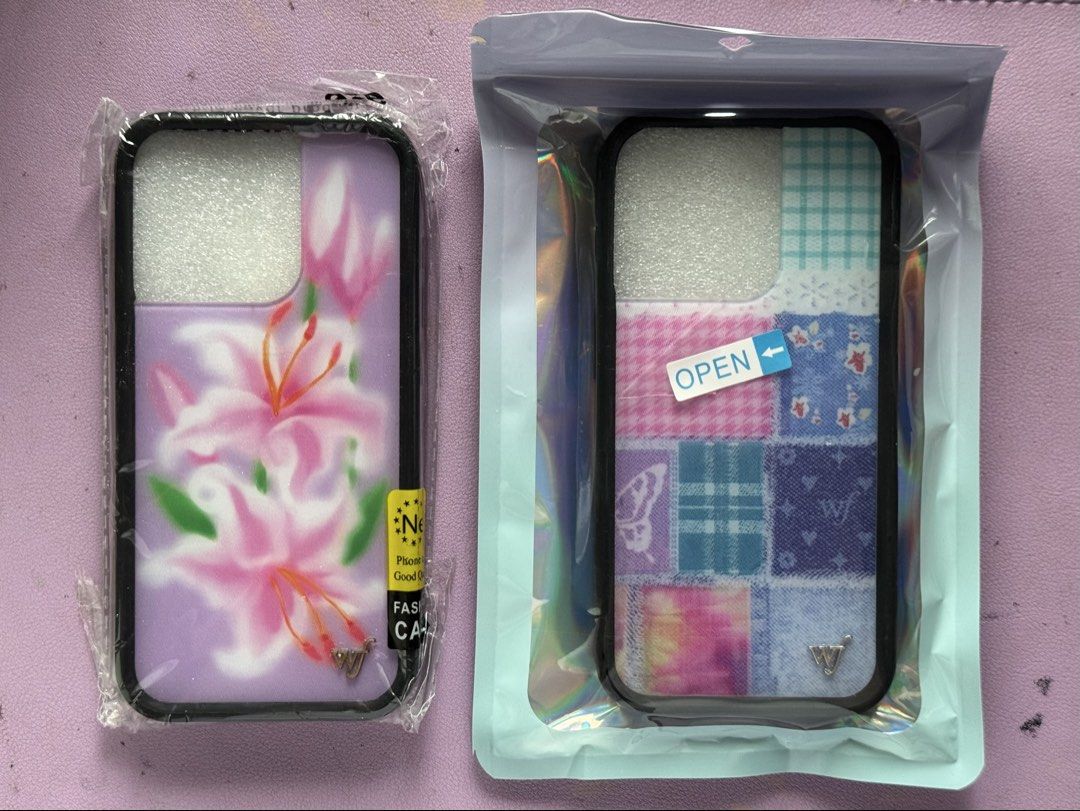 iphone 15 pro patchwork phone case - wildflower dupe (Category: Cases & Sleeves) located in Quezon City. Submitted by maejichoco (Listing ID 1455394637, Image 1). Description: iPhone 15 Pro - wildflower patchwork phone case dupe - bought from the orange app - condition: BRAND NEW & never used will include FREE lilac phone case (condition: used & logo rusting).