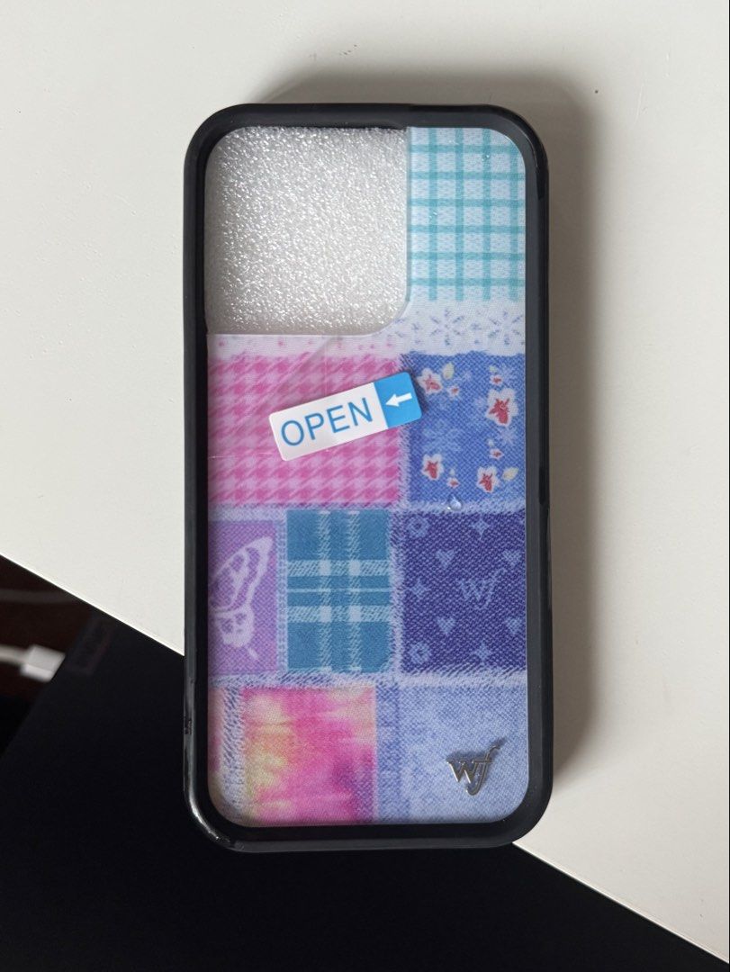 iphone 15 pro patchwork phone case - wildflower dupe (Category: Cases & Sleeves) located in Quezon City. Submitted by maejichoco (Listing ID 1455394637, Image 2). Description: iPhone 15 Pro - wildflower patchwork phone case dupe - bought from the orange app - condition: BRAND NEW & never used will include FREE lilac phone case (condition: used & logo rusting).