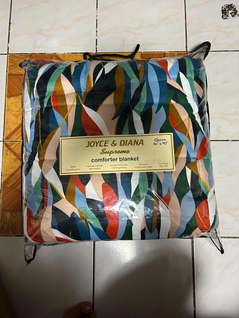 Joyce & Diana Supreme Comforter Blanket Queen (Category: Bedding & Towels) located in Manila. Submitted by essentialattributes (Listing ID 1455329547, Image 1). Description: - Queen Size Comforter Blanket (86" x 90") - Brand: Joyce & Diana Supreme - 100% Hypoallergenic Material - Supreme Softness and Comfort - Luxurious Fiber Fill for All-Season Temperature - Machine Washable - Long-Lasting Quality - Comes in a Reusable Bag.