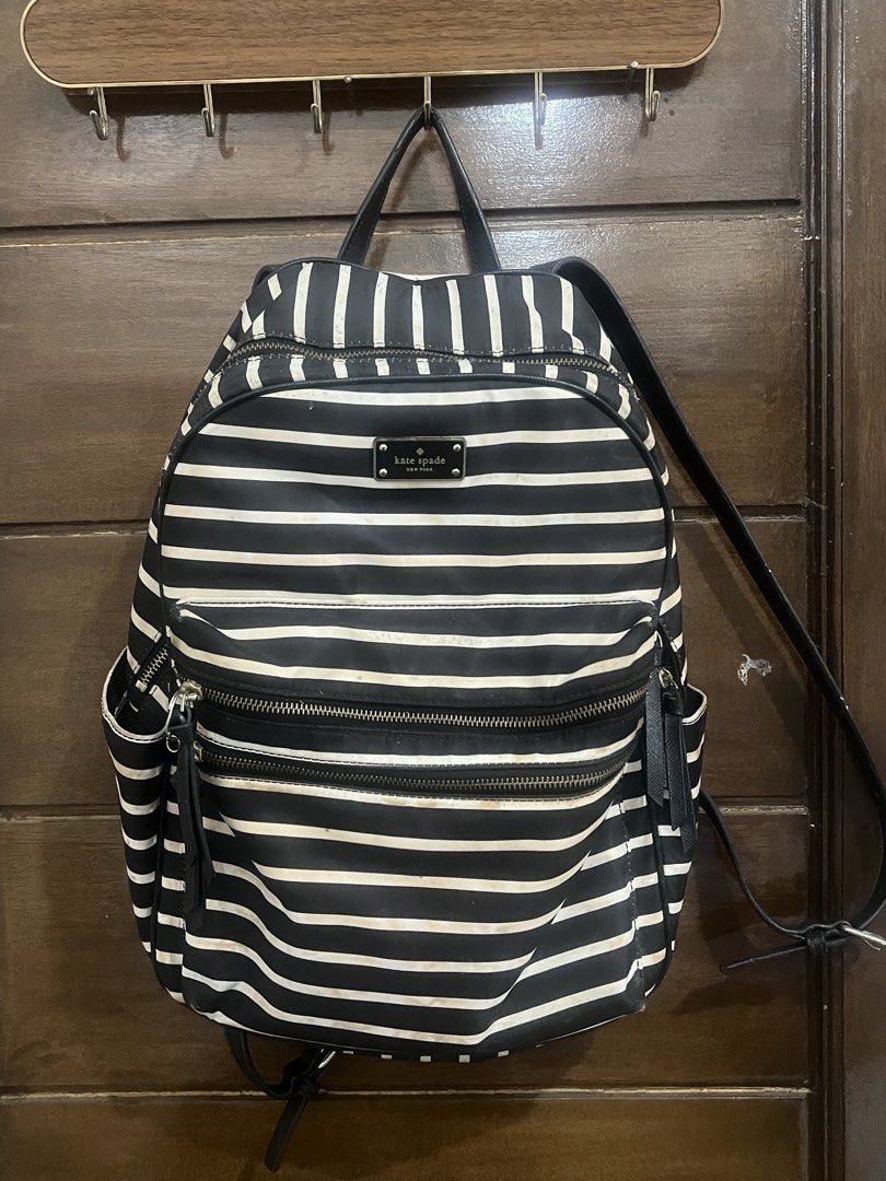 Kate Spade New York Striped Backpack (Category: Backpacks) located in Quezon City. Submitted by ch0wy (Listing ID 1455345386, Image 2). Description: - ORIGINAL Classic black and white striped backpack by Kate Spade. (Note: PLEASE LOWER YOUR EXPECTATIONS AS THIS IS ALREADY A PRE-LOVED BAG, THIS BAG NEEDS CLEANING TOO SINCE DI KO NA TALAGA NAGAMIT BUT ALL IN ALL STILL WORTH IT) - Multiple zippered compartments and pockets for organization. - Interi