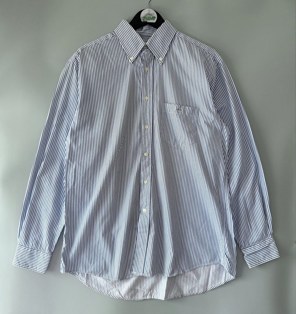 Lacoste stripe (Category: Formal Shirts) located in Cebu City. Submitted by bestpicked (Listing ID 1455407176, Image 1). Description: Authentic Excellent condition Size 40 on tag Dimension 23x28-30 inches Best fit large No issue Location- Cebu City We ship nationwide Mod payment - Bank transfer/Gcash.